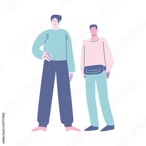 Two young positive boys brothers or friends standing in queue