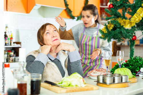 Women quarreling at kitchen
