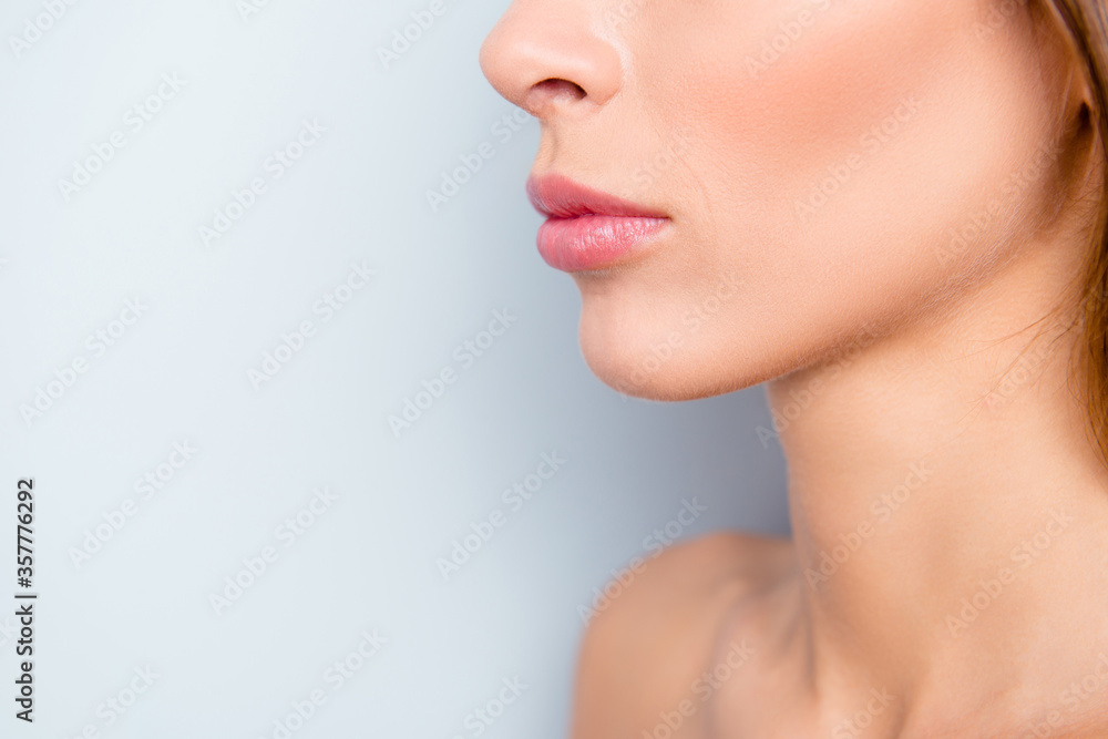 Cropped close-up portrait of attractive lady with perfect lips form shape curves flawless pure shine clean clear skin trend professional filler isolated over light gray background Cropped close-up portrait of attractive lady with perfect lips form shape curves flawless pure shine clean clear skin trend professional filler isolated over light gray background