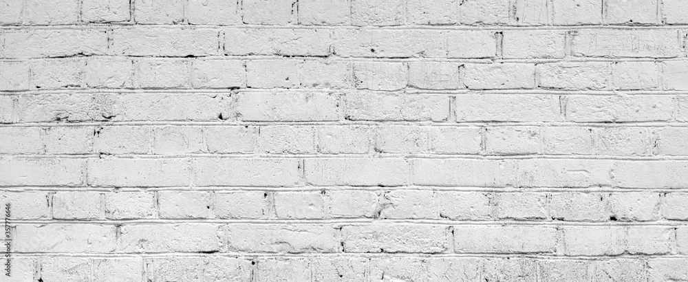 Fototapeta premium White brick wall. Facade of an old building. Architectural background.