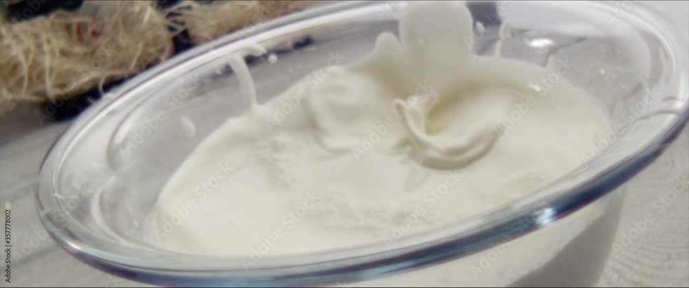 Strawberry falls into milk Slow Motion Macro Strawberry falls into milk Slow Motion Macro