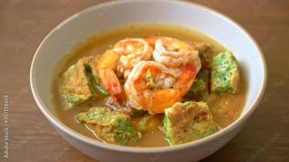 Sour soup made of Tamarind Paste with Shrimps and Vegetable Omelet - Asian food style Sour soup made of Tamarind Paste with Shrimps and Vegetable Omelet - Asian food style