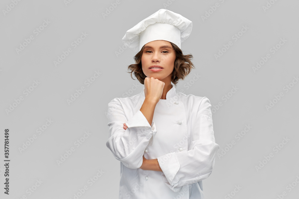 cooking, culinary and people concept - female chef in toque thinking over grey background cooking, culinary and people concept - female chef in toque thinking over grey background