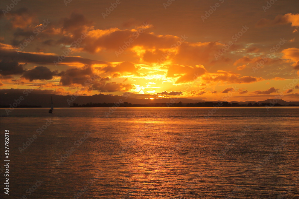 Tauranga New Zealand golden sunsets , sail boat caught in silhouette form