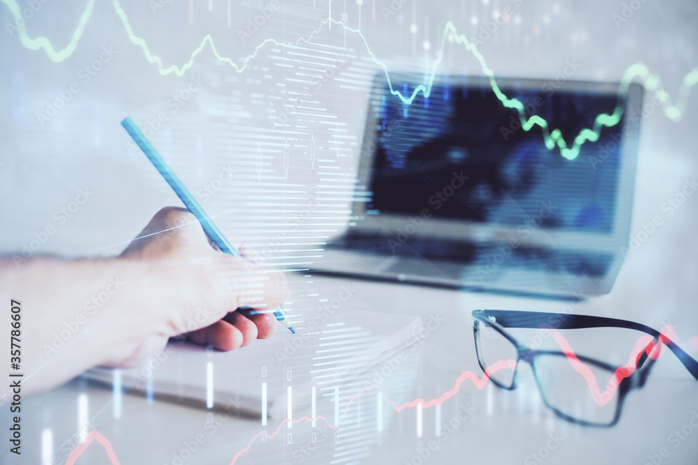 Multi exposure of man hands with stock market forex graph. Multi exposure of man hands with stock market forex graph.