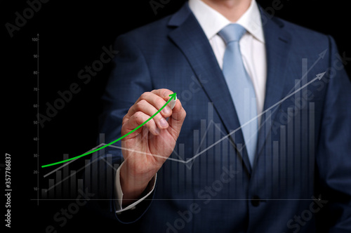 Businessman pointing graph corporate future growth plan.