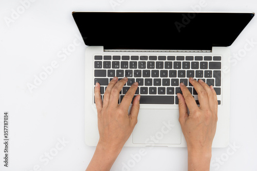 crumpled paper, notebook, computer and pencil