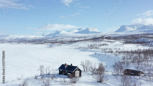 Flying above the frozen Torneträsk Lake and towards Lapporten. Swedish Lapland.