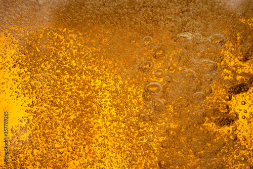 Close up beer bubble foam in glass textue alcohol background © Love the wind