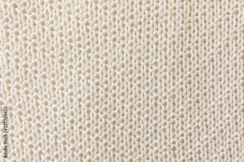  Loose Knitwear Fabric Texture. Repeating Machine Knitting of warm Sweater backdrop. White knitted fabric background. Retro abstract pattern with soft beige knitted cloth for decorative design.