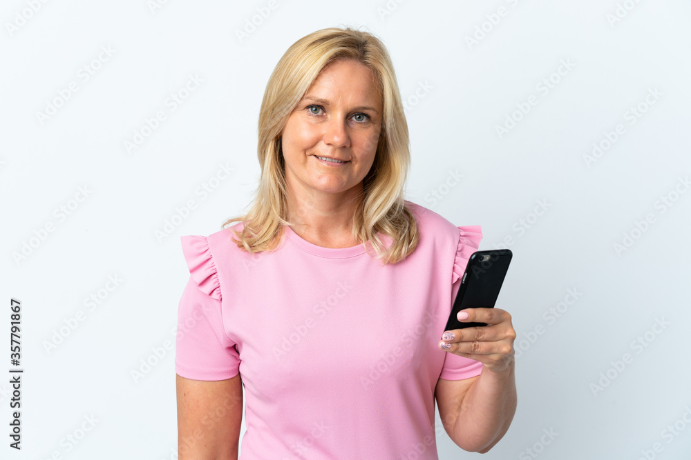 Middle age using mobile phone isolated on white background smiling a lot Middle age using mobile phone isolated on white background smiling a lot