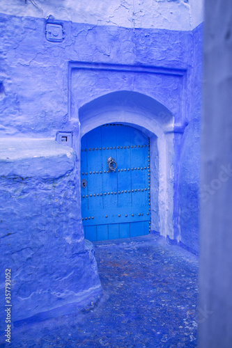 Blue door in Chefchaouen, Morocco. © Celeste