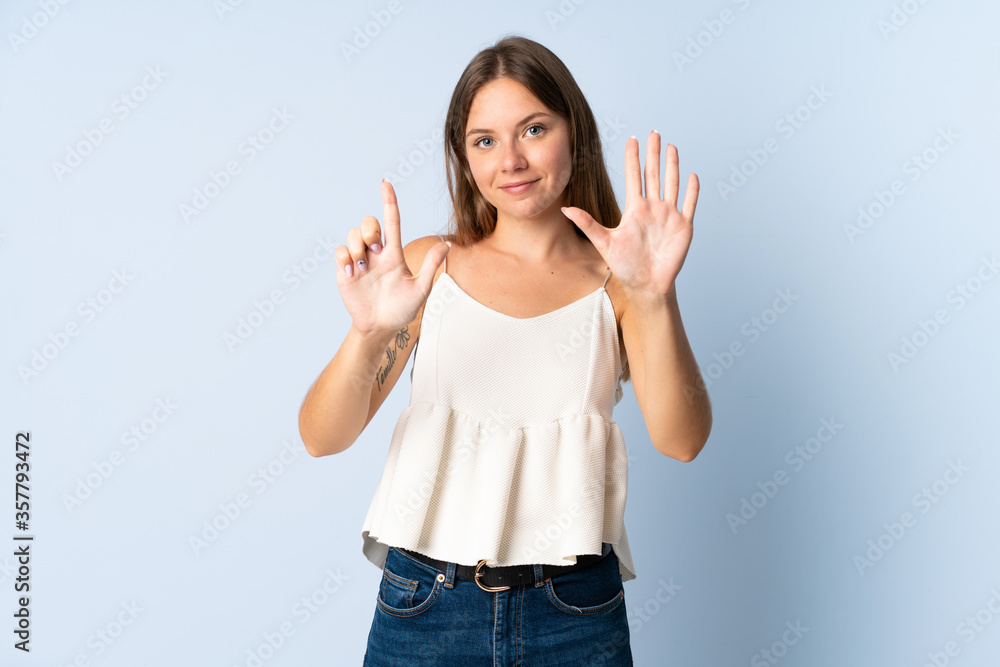 Young Lithuanian woman isolated on blue background counting seven with fingers Young Lithuanian woman isolated on blue background counting seven with fingers