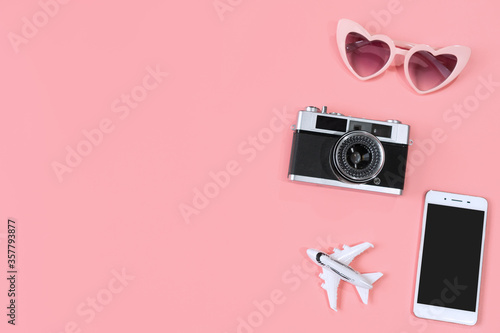 Top view of travel accessories on pink color background, travel concept. Flat lay , copy space