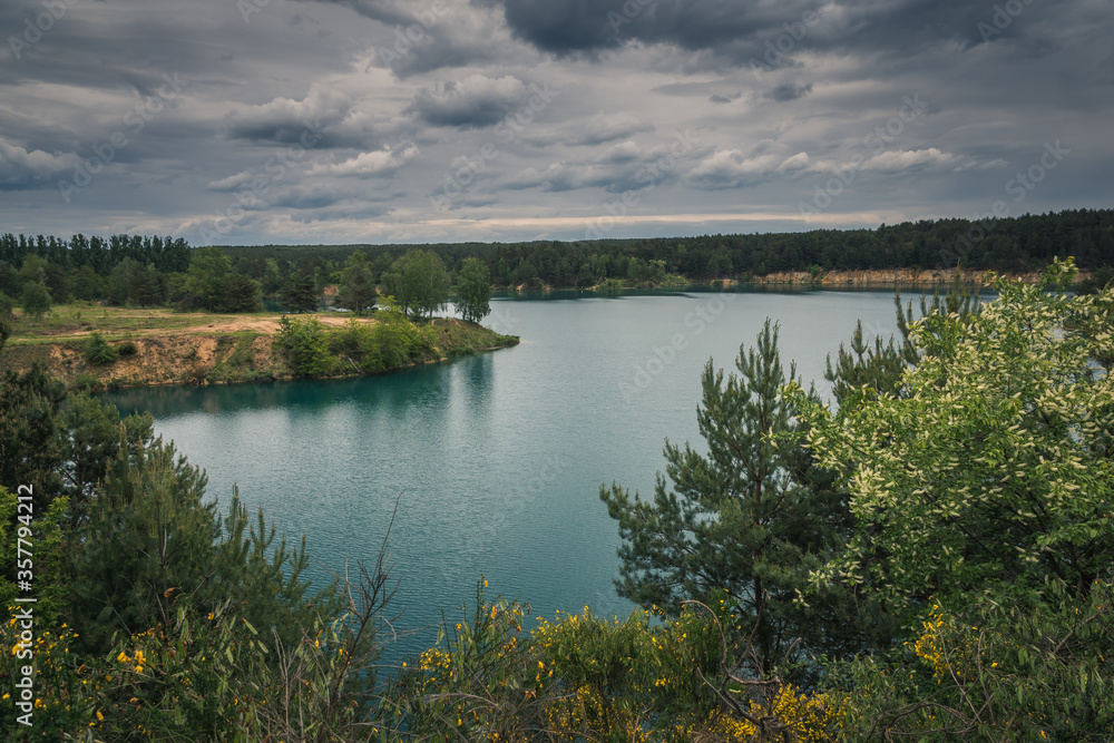 Turquoise lake Wapienniki near Sulejow, Lodzkie, Poland