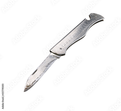 Old metal folding pocket knife isolated on a white background.
