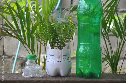 Recycled colored flower pots made of used plastic bottles. Nice decoration for inside and outside.