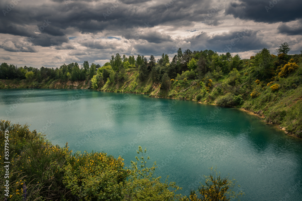Turquoise lake Wapienniki near Sulejow, Lodzkie, Poland