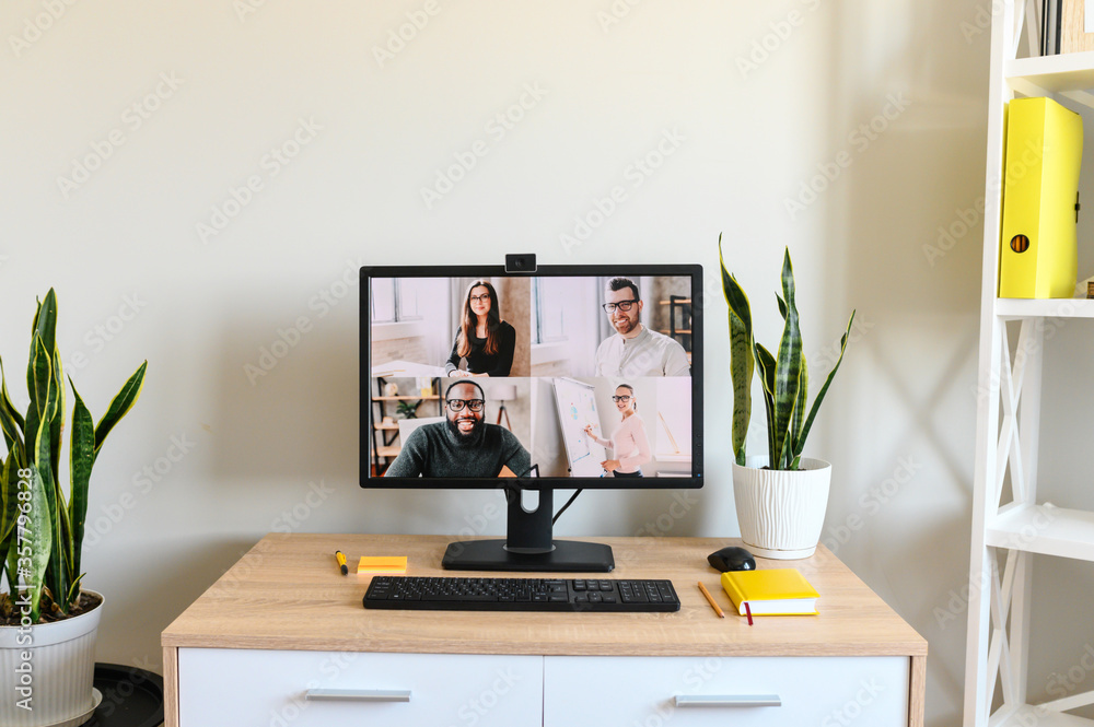 No people in the office. PC display with video meeting on it No people in the office. PC display with video meeting on it