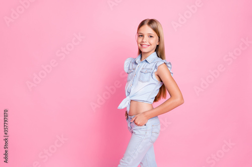 Portrait of nice cute adorable girl put hands pocket posing wear casual style clothes isolated over pastel color background © deagreez