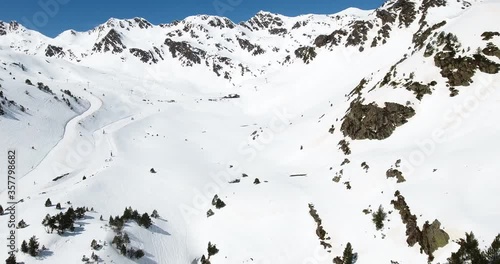 Ski slope in a snowny mountain, drone plan photo