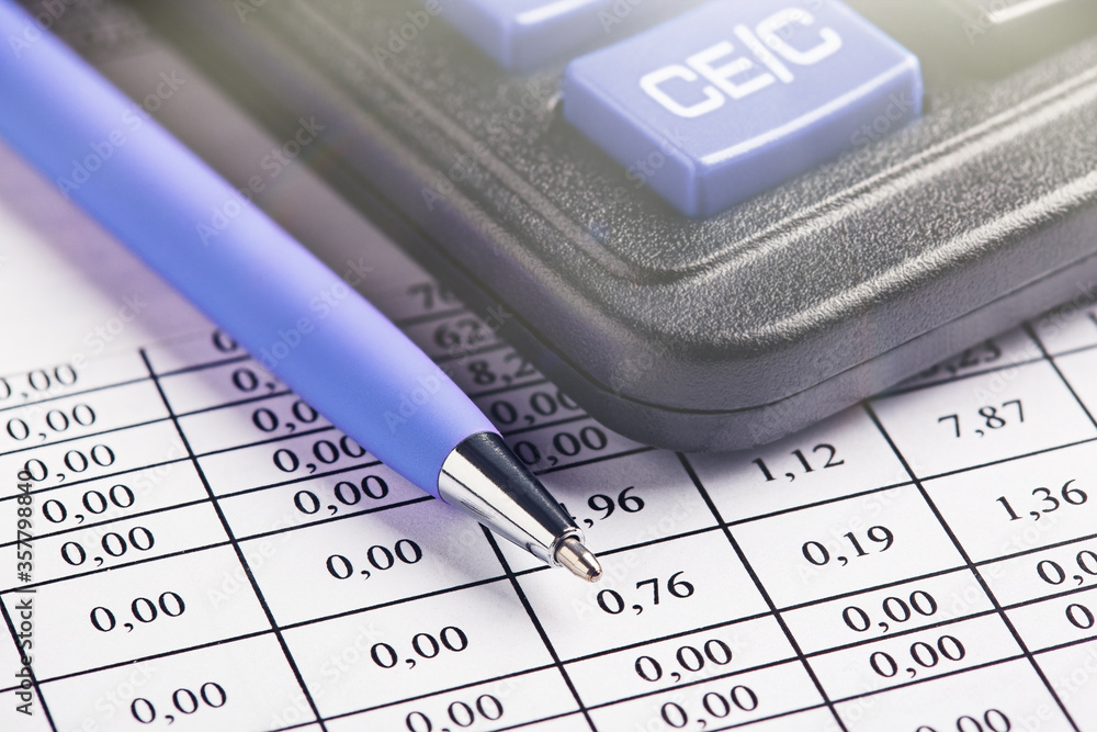 accounting document with pen and calculator. Concept of banking, financial report and financial audit. accounting document with pen and calculator. Concept of banking, financial report and financial audit.