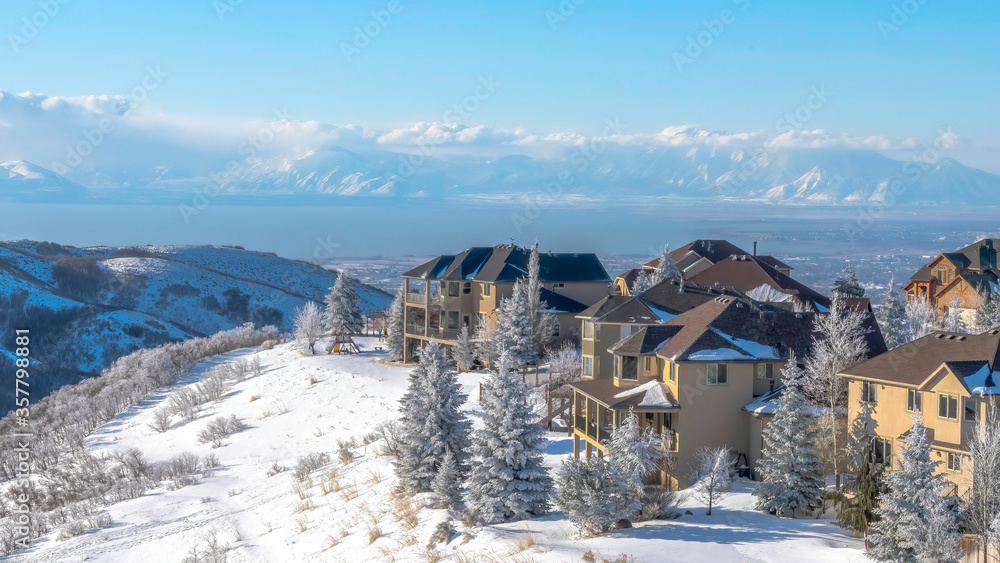 Panorama Lovely homes with scenic view of sweeping valley and towering Wasatch Mountains