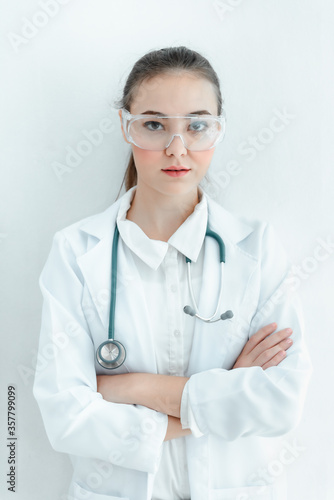 Portrait of Female Doctor With Stethoscope in Medical Uniform Arms Crossed Posing on Isolated Background  Smart Physician Doctor in Patient Clinic Hospital. Doctors Occupation Medicine Healthcare