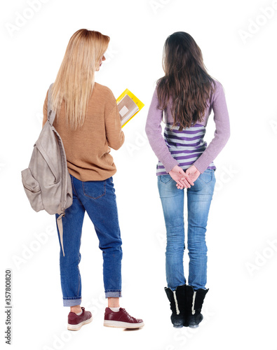 Back view of two woman in sweater.