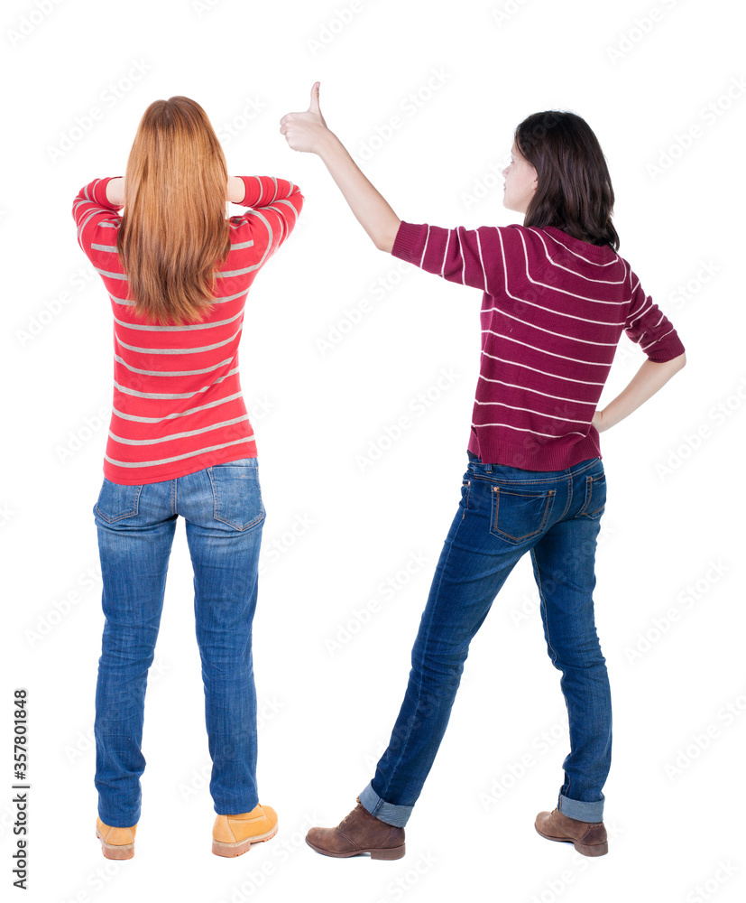 Back view of couple in sweater showing thumbs up.