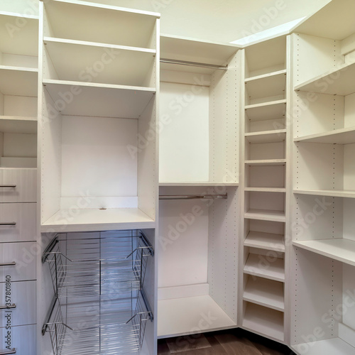 Square crop Walk in closet interior with shelves hanging rods drawers and metal baskets