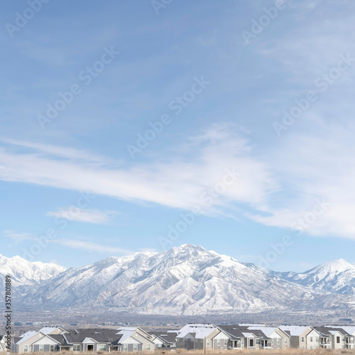 Square crop Striking Wasatch Mountains and South Jordan City in Utah during winter season © Jason