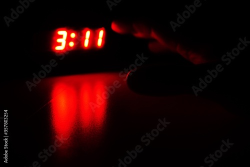 turning off the ringing alarm clock in the night - night shift-  early shift