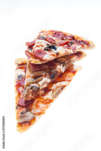 Hunting pizza with sausages, mushrooms and cheese sauce
