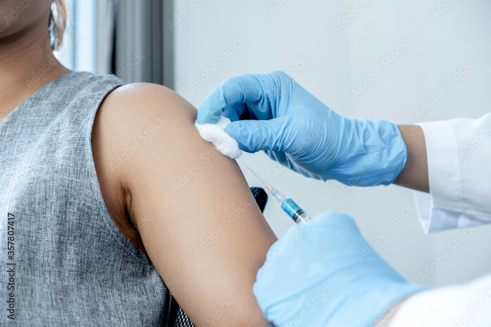 doctors vaccinated with syringes to prevent epidemics at hospitals, health care and medical concepts doctors vaccinated with syringes to prevent epidemics at hospitals, health care and medical concepts