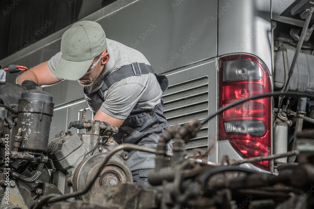 Caucasian Mechanic and the Coach Bus Diesel Engine Regeneration
