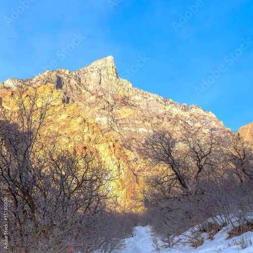 Square frame Trail on a snowy mountain overlooking a steep rocky peak in Provo Canyon Utah