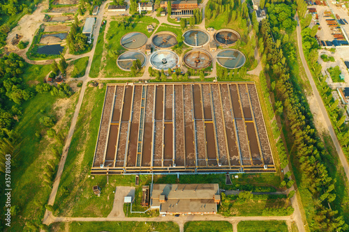 Modern Wastewater Treatment Plant with sedimentation tanks and pools with sludge filtration of sewer water, aerial view.