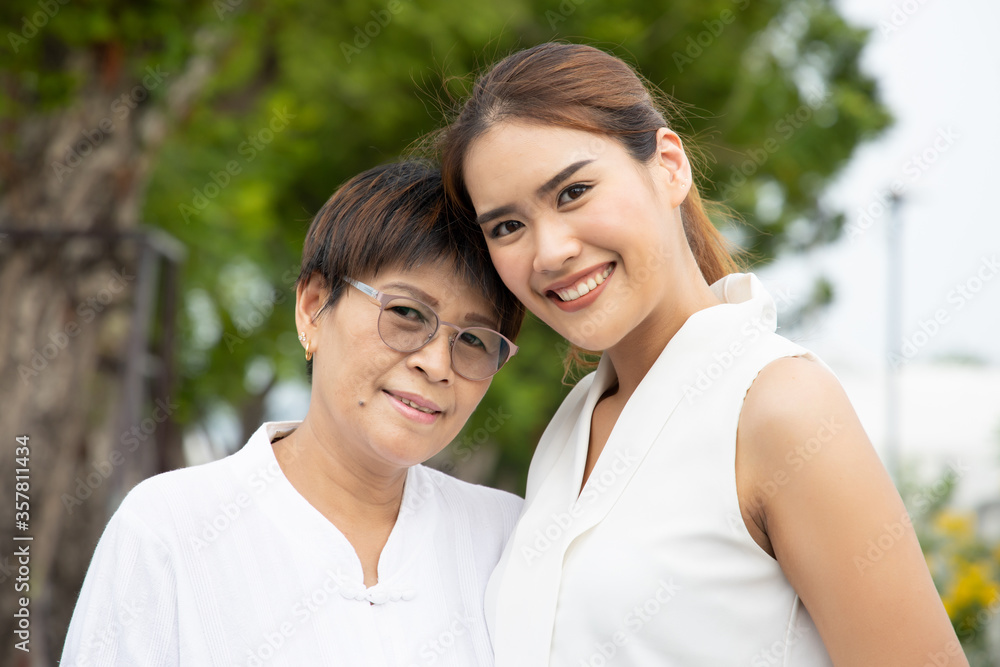 portrait of happy senior mother and adult daughter, happy family concept portrait of happy senior mother and adult daughter, happy family concept