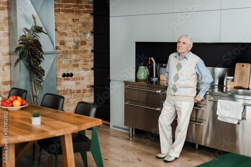 sad lonely elderly man on kitchen during self isolation © LIGHTFIELD STUDIOS