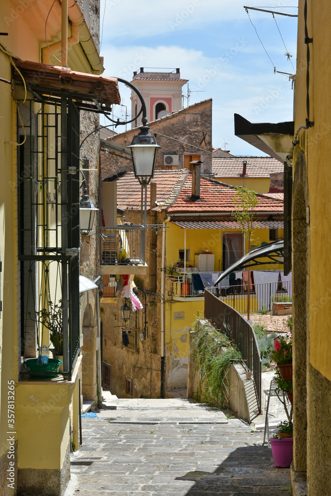 Naklejka premium A narrow street between the houses of the medieval town of Eboli in the province of Salerno, Italy.
