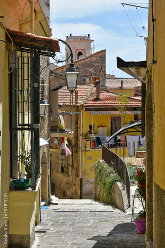 A narrow street between the houses of the medieval town of Eboli in the province of Salerno, Italy. photo