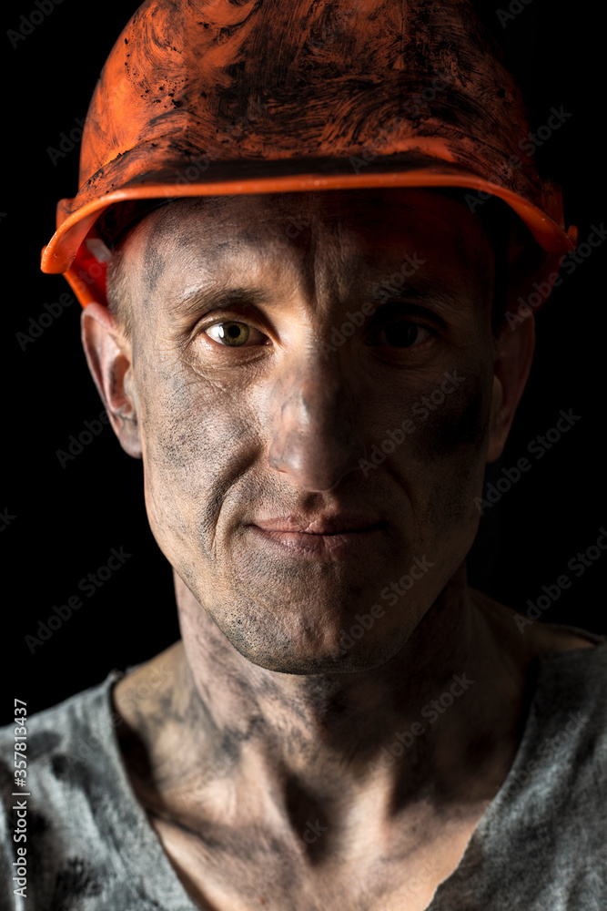 Portrait of a male miner in a helmet. Portrait of a male miner in a helmet.