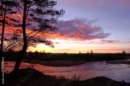 Beautiful crimson sunset over the river.