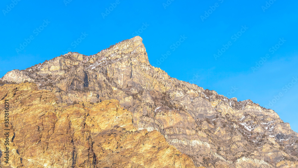 Panorama Steep peak and rocky slopes of a mountain in Provo Canyon Utah on a sunny day
