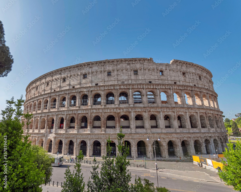 Rome Italy, impressive view of the Colosseum ancient amphitheater under clear blue sky