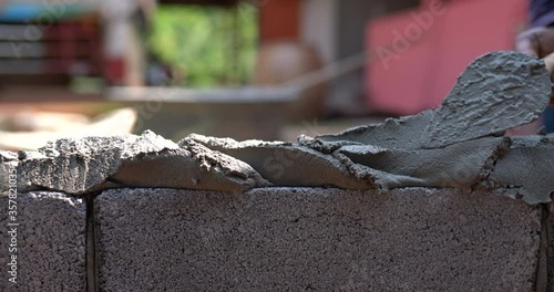 Techniques for cement masonry for the construction of building fences photo