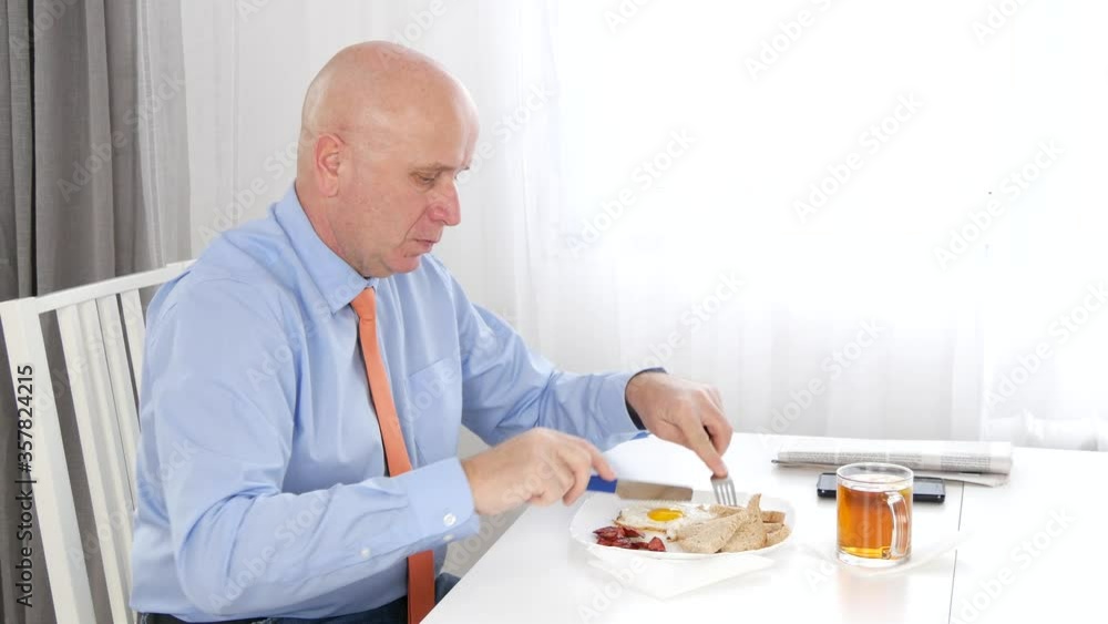 Businessman Eating in a Restaurant, Hungry Person Taking Meal Businessman Eating in a Restaurant, Hungry Person Taking Meal
