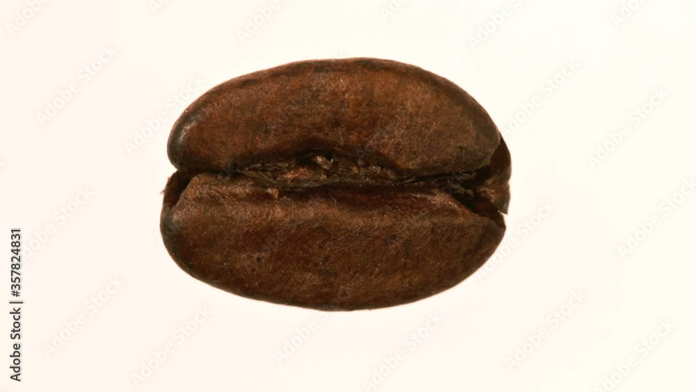Close up of coffee beans against a white background Close up of coffee beans against a white background