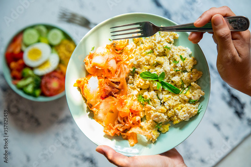 Schilderij op canvas Scrambled Egg and Kimchi along with a Bowl of Salad
